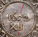 Illustration of the specifics of the Silver Shilling "Pine Tree" 1652 KM# 15